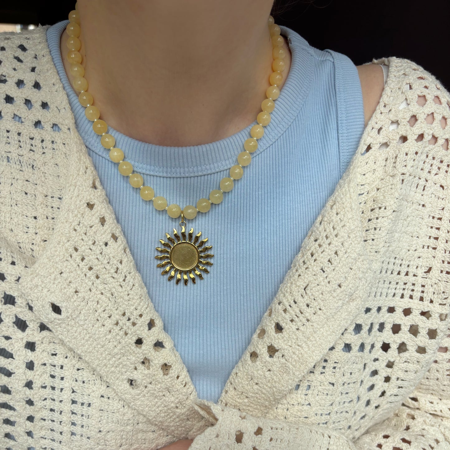 Celeste ketting met zonbedel